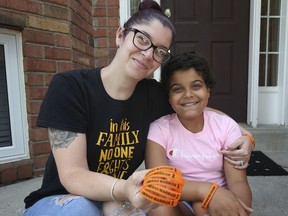 Liz Agostinis-Dorr and her daughter Amirah, 10, are shown at their Windsor home on Tuesday, June 22, 2021. Last spring Amirah was diagnosed with leukemia and since then, has endured many treatments, but has kept a positive attitude and with the love and support of her family.