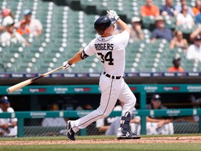 Jun 10, 2021; Detroit, Michigan, USA;  Detroit Tigers catcher Jake Rogers (34) hits a home run in the second inning against the Seattle Mariners at Comerica Park. Mandatory Credit: Rick Osentoski-USA TODAY Sports