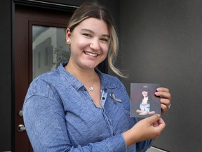 Natalie Galarnyk poses with a photo of her sister Katrina on Monday, June 21, 2021. Katrina died of a brain tumour and her whole family has remains quite involved in the brain tumour foundation and annual walk.