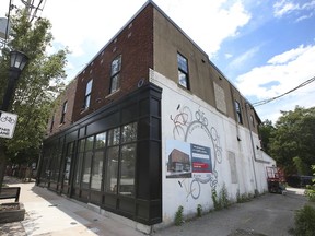 The former Courtesy Bicycles store on Sandwich Street in Windsor is shown on Tuesday, June 15, 2021. A dispute is ongoing regarding a window that was bricked in during renovations.