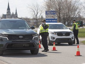 Ontario Provincial Police check travellers entering Ontario from Quebec as new COVID-19 measures take effect Monday, April 19, 2021 in Hawkesbury, Ontario.