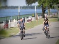 Cyclists enjoy the biking and walking trails along the Windsor riverfront, on Wednesday, June 16, 2021.