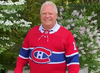 Ontario Premier Doug Ford dons a Guy Lafleur jersey as part of a bet with his Quebec counterpart Francois Legault after the Maple Leafs lost their series with the Habs.