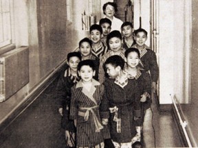 Aboriginal children at the Brandon Sanatorium in the mid-1950s head off to the schoolroom. A University of Windsor researcher is taking part in an anthropological forensic study of remains at the residential school in the same Manitoba city.