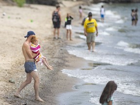 AMHERSTBURG, ONTARIO:. JUNE 12, 2021 - Beachgoers enjoy the sun and sand at Holiday Beach on the first day of being open for the season, on Saturday, June 12, 2021.