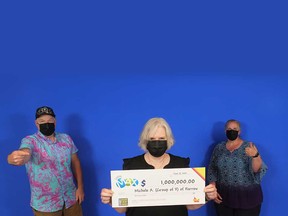 From left: Michael Allen of Windsor, Michele Allen of Harrow, and Dana Harris of Harrow with their $1-million prize cheque for winning Maxmillions on the Lotto MAX draw of June 4, 2021.