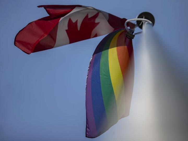  The Pride flag flies alongside the Canadian flag at Walkerville Collegiate Institute on Thursday, June 10, 2021.