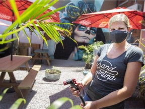 Rosemary Woods, co-owner of the F&B Hospitality Group, prepares the patio at the Grand Cantina for re-opening, on Wednesday, June 9, 2021.