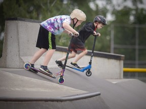 Cameron, left, and Ethan enjoy the opening of the Tecumseh Skate Park on Wednesday, June 2, 2021, on the first day of reopening Ontario.