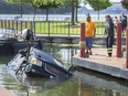 Crews with Coxon's Towing and LaSalle Towing and Recovery pull a vehicle that was fully submerged at the bottom of the LaSalle Marina on Monday, June 28, 2021.  A boater was attempting to launch a boat when his vehicle rolled backwards into the water. The incident occurred shortly after noon Monday and took until about 5 p.m. to return the land vehicle back to terra firma.