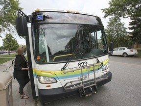 A woman boards a Transit Windsor 1C Transway bus on Rivard Avenue in Windsor on Thursday, June 3, 2021. The city is removing some stops along the route.