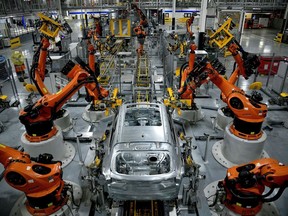 FILE PHOTO: Autonomous robots assemble an X model SUV at the BMW manufacturing facility in Greer, South Carolina, U.S. November 4, 2019.