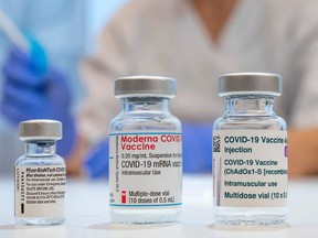Used vaccine vials of Pfizer-BioNTech, Moderna, and AstraZeneca Covid-19 vaccines are shown at a hospital in Sweden in this February 2021 file photo.