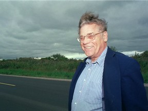 "John was brilliant." John Spellman is shown standing near the Big Creek watershed on Sept. 26, 2001, during one of his environmental battles, this one over perceived threats to the wetland from a proposed townhouse development.