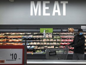 A man shops in the meat section at a grocery store, April 28, 2020 Washington, DC.