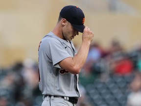 Matt Manning of the Detroit Tigers looks on after hitting Brent Rooker of the Minnesota Twins with a pitch in the third inning of the game at Target Field on July 26, 2021 in Minneapolis, Minnesota.