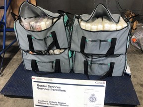 Duffle bags containing suspected cocaine which were seized in the Fort Erie District on June 15, 2021.