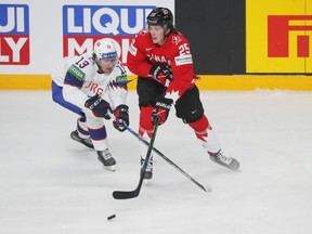 Owen Power (right) shown here in action for Canada at the 2021 world hockey championship, is expected to be the No. 1 pick in tonight's NHL entry draft by the Buffalo Sabres.