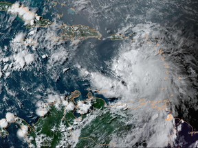 This National Oceanic and Atmospheric Administration (NOAA) satellite image taken on July 2, 2021 shows hurricane Elsa moving northwest near St. Vincent and the Grenadines in the eastern Caribbean.