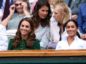 Britain's Catherine (left), Duchess of Cambridge and Britain's Meghan, Duchess of Sussex, watch American Serena Williams during their women's singles final at the 2019 Wimbledon Championship.