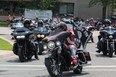 A convoy of motorcycles leaves Elgin-Middlesex Detention Centre, where nearly 1,000 people gathered to protest the death of inmates Saturday, July 17, after the funeral of Brandon Marchant, the latest inmate to die at the London jail. (Dale Carruthers/The London Free Press)