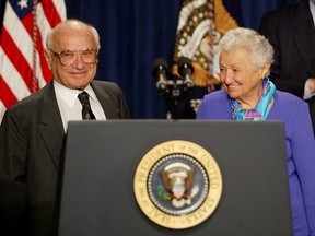 President George W. Bush honours Milton Friedman (left), the recipient of the 1976 Nobel Memorial Prize for Economic Science, on the occasion of his 90th birthday and joined by his wife Dr. Rose Friedman during a tribute at the Eisenhower Executive Office Building in this May, 2002 file photo in Washington.