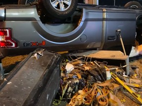 Police share photo of flipped pickup packed with tools