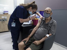 A man receives his third dose of COVID-19 vaccine at Sheba Medical Center on July 14, 2021 in Ramat Gan, Israel.