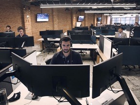 Employees with Edison Financial in Windsor are shown on Wednesday, July 28, 2021 on the sales floor inside the Rocket Innovation Studio in downtown Windsor.