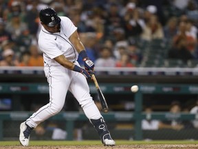 Detroit Tigers designated hitter Miguel Cabrera hits a single during the seventh inning against the Baltimore Orioles at Comerica Park.