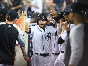 Jul 20, 2021; Detroit, Michigan, USA; Detroit Tigers right fielder Robbie Grossman (8) celebrates his home run during the first inning against the Texas Rangers at Comerica Park. Mandatory Credit: Tim Fuller-USA TODAY Sports
