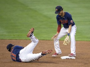 Minnesota Twins second baseman Jorge Polanco flips the ball to shortstop Andrelton Simmons for an out in the sixth inning against the Detroit Tigers at Target Field.
