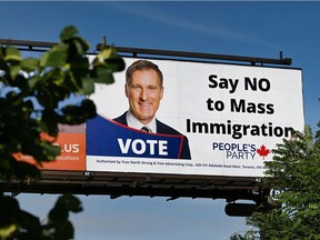 A billboard featuring the portrait of People's Party of Canada (PPC) leader Maxime Bernier in Toronto, Aug. 26, 2019.