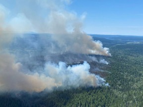 This handout photo courtesy of B.C. Wildfire Service shows a wildfire southwest of Deka Lake (C41102), which is estimated to be 200 hectares, British Columbia, on July 2, 2021.