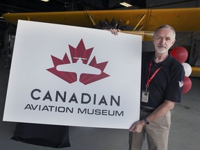 The Canadian Historical Aircraft Association unveiled the museum's new name and logo on Thursday, July 22, 2021. Don Christopher, president of the association displays the logo during a press conference in Windsor.
