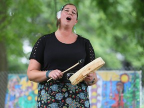 Andria Dyer sings and drums during a VIP event for Awaken Your Spirit, an Indigenous tourism experience at TJ Stables in Chatham, Ont., on Tuesday, July 27, 2021. (Mark Malone/Chatham Daily News/Postmedia Network)