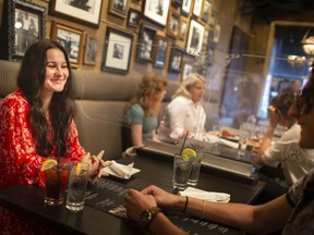 Martha Bianchi, left, and Michael Biundo, dine at Vito's Pizzeria on the first day of Step 3 of reopening that includes dining inside restaurants, on Friday, July 16, 2021.