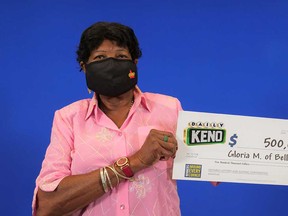 Belle River resident Gloria Miller with her prize cheque of $500,000 that she won playing Daily Keno.