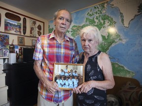 Keith and Marcia Spratt with the Hearts Together for Haiti organization are shown July 8, 2021, holding a photo of Haitian children from the Kaynou Orphanage they founded.