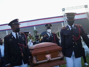 Pallbearers in military attire carry the coffin holding the body of late Haitian President Jovenel Moise after he was shot dead at his home in Port-au-Prince earlier this month, in Cap-Haitien, July 23, 2021.