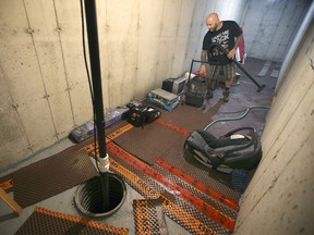 Days after a huge rain Craig Weir was still cleaning up a section of his flooded basement at his Maplewood Drive home in Lakeshore on Monday, July 19, 2021.