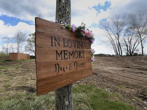 A memorial for Dave and Dianne Nadalin, killed in a July 12, 2020, house explosion on Marentette Beach in Leamington, is shown on April 30, 2021, in front of the couple’s levelled property.