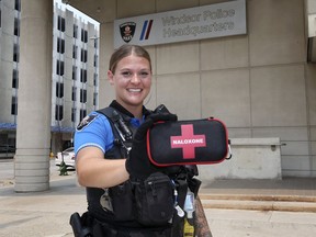 Windsor Police Service Const. Chelsey Drouillard displays a naloxone kit on Tuesday, July 20, 2021 in front of the downtown headquarters.