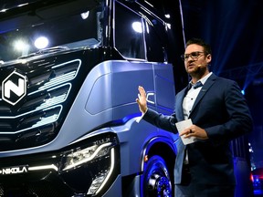 FILE PHOTO: CEO and founder of U.S. Nikola Trevor Milton speaks during presentation of its new full-electric and hydrogen fuel-cell battery trucks in partnership with CNH Industrial, at an event in Turin, Italy, December 2, 2019.