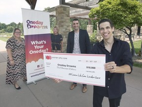 Chantellle Meadows, left, and Liz Fanaro from the 100 Women Who Care Windsor-Essex organization presented $10,000 to Oneday Dreams founders Michael Bennett and Jason Soulliere (right) on July 7, 2021, at Jackson Park in Windsor.