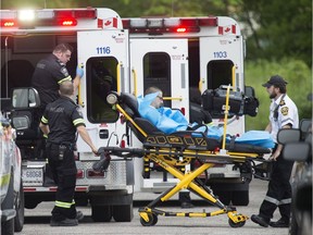 A male is wheeled out on a stretcher by EMS Paramedics after a suspected near overdose of fentanyl on the 1300 block of Ellrose Ave.,  Friday, May 26, 2017.