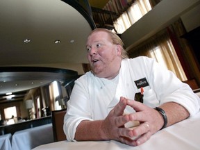 Celebrity chef Mario Batali talks during an interview with Reuters at his restaurant, Del Posto, in New York April 11, 2006.