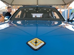 FILE PHOTO: The logo for electric vehicle startup Rivian is seen on the hood of its new R1T all-electric truck in Mill Valley, California, U.S., January 25, 2020.