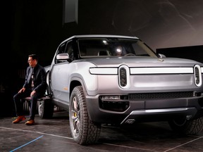 FILE PHOTO: R.J. Scaringe, Rivian's CEO, introduces his company's R1T all-electric pickup truck at Los Angeles Auto Show in Los Angeles, California, U.S. November 27, 2018.
