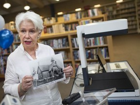 Ward 6 Coun. Jo-Anne Gignac holds up an old black and white photograph of the Riverside area during an unveiling of a new scanner at the Riverside Branch of the Windsor Public Library, on Thursday, July 15, 2021.  The scanner will be used for the Riverside Memories project, commemorating the centenary of the Town of Riverside.
